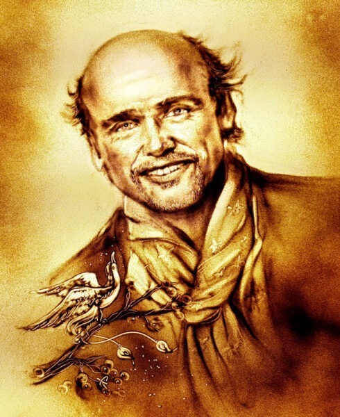 Detailreiches Sandportrait eines Mannes, live erstellt von den Sandartisten